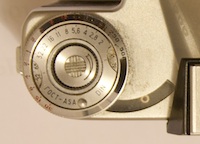 Close-up of the knob and light meter on a Zenit E SLR camera