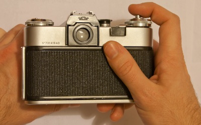 Taking a photo with a Zenit E SLR camera