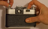 Rewinding the film on a Zenit E SLR camera